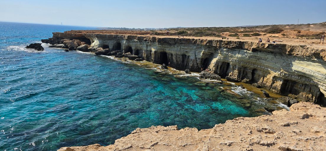 rocky caves and turquoise sea at Cape Greco in Cyprus