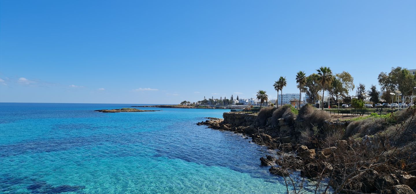 rocky coastline of Protaras with turquoise water and palm trees