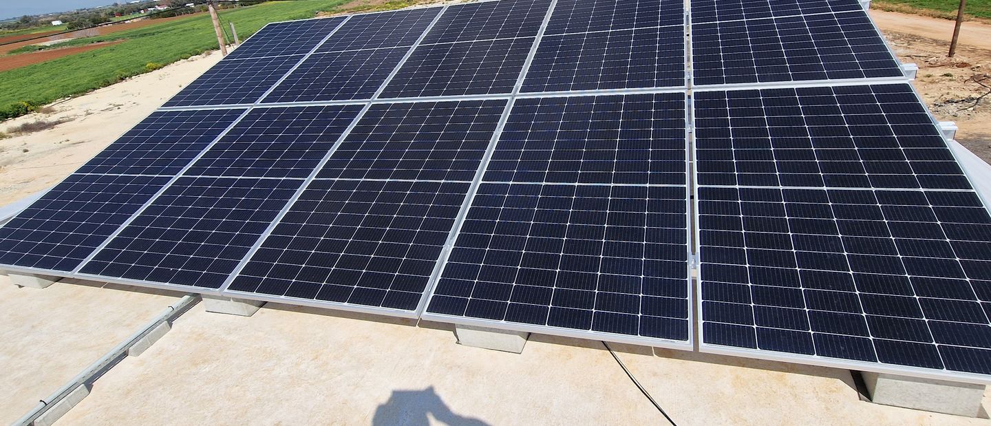 photovoltaic panels mounted on a flat roof of a house in Cyprus