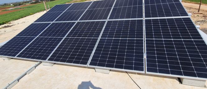 photovoltaic panels mounted on a flat roof of a house in Cyprus