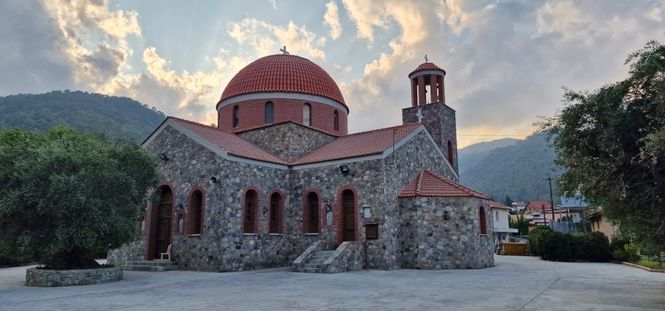 stone church with a red dome in the Troodos mountains of Cyprus